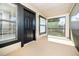 A shaded patio with lots of sunlight and a black front door at 4015 Angel Oak Ct # 201, Tampa, FL 33613