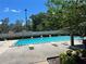 An inviting community pool with lounge chairs for relaxation at 4015 Angel Oak Ct # 201, Tampa, FL 33613