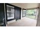 Condo porch view with an enclosed patio space featuring black railings, a large window, and painted trim at 4015 Angel Oak Ct # 201, Tampa, FL 33613