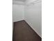 A walk-in closet with carpeting, shelves, and hanging rods at 4015 Angel Oak Ct # 201, Tampa, FL 33613