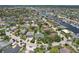 An aerial view displays a charming neighborhood with lush trees, well-maintained homes, and convenient access to the waterfront at 4052 Marine Pkwy, New Port Richey, FL 34652