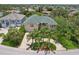 Aerial view of a well-maintained home with a green roof and circular driveway at 4052 Marine Pkwy, New Port Richey, FL 34652