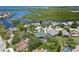A stunning aerial view displays waterfront homes with lush landscaping and access to tranquil waterways at 4052 Marine Pkwy, New Port Richey, FL 34652
