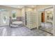 Bathroom with a unique glass block shower, corner tub, and access to the backyard at 4052 Marine Pkwy, New Port Richey, FL 34652