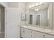 Bathroom featuring dual sinks with vanity and a separate shower area at 4052 Marine Pkwy, New Port Richey, FL 34652