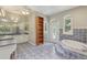 Spacious bathroom with tub, double sinks and a storage closet at 4052 Marine Pkwy, New Port Richey, FL 34652