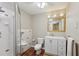 Well-appointed bathroom with a stand-up shower, toilet, urinal, and updated vanity with storage at 4052 Marine Pkwy, New Port Richey, FL 34652