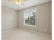 Cozy bedroom with a window overlooking the yard at 4052 Marine Pkwy, New Port Richey, FL 34652