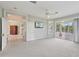 Spacious bedroom with access to a private lanai, neutral decor, and a serene atmosphere at 4052 Marine Pkwy, New Port Richey, FL 34652