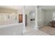 Bright hallway with chandelier and elegant columns leading to a living area at 4052 Marine Pkwy, New Port Richey, FL 34652