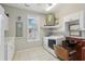 Well-equipped laundry room with appliances and a salon-style hair washing station at 4052 Marine Pkwy, New Port Richey, FL 34652