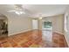 Spacious living area with terra-cotta tile flooring and sliding glass doors to the pool at 4052 Marine Pkwy, New Port Richey, FL 34652
