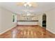 Large living space featuring terra-cotta floors, fan, built-in bar, and generous natural light at 4052 Marine Pkwy, New Port Richey, FL 34652