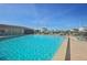 A large, inviting pool with lounge chairs and umbrellas provides a relaxing and enjoyable experience on a sunny day at 4052 Marine Pkwy, New Port Richey, FL 34652
