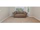 Cozy sitting area features neutral carpeting, large windows, and natural light, ideal for relaxation at 4052 Marine Pkwy, New Port Richey, FL 34652