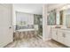 Relaxing bathroom featuring a tub and shower at 4083 Woods Rider Loop, Odessa, FL 33556