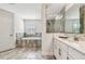 Luxurious bathroom with a soaking tub, a shower, and double vanities at 4083 Woods Rider Loop, Odessa, FL 33556