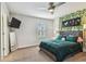 Charming bedroom with horse art, decorative wall vines, and stylish gray upholstered headboard at 4083 Woods Rider Loop, Odessa, FL 33556