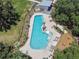 Resort-style community pool features ample seating, a splash pad, and well-maintained landscaping at 4083 Woods Rider Loop, Odessa, FL 33556