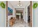 Grand foyer featuring wood-look tile flooring, console table, and open view into living spaces at 4083 Woods Rider Loop, Odessa, FL 33556