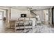 Bright living room featuring hardwood floors, a ceiling fan, stairs and neutral decor at 4083 Woods Rider Loop, Odessa, FL 33556