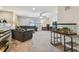Expansive living room with comfortable seating, a ceiling fan, and a dedicated desk area at 4083 Woods Rider Loop, Odessa, FL 33556