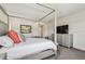 Cozy bedroom with canopy bed and media center at 4083 Woods Rider Loop, Odessa, FL 33556