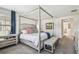Well-lit bedroom with canopy bed and elegant decor at 4083 Woods Rider Loop, Odessa, FL 33556