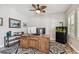 Comfortable office space with stylish ceiling fan, wood desk, fish tank and custom carpet at 4083 Woods Rider Loop, Odessa, FL 33556