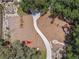 Community playground with a variety of structures including slides, climbing structures, and woodchip ground cover at 4083 Woods Rider Loop, Odessa, FL 33556