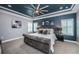 Spacious bedroom with accent wall, white trim, plantation shutters and large ceiling fan at 4197 Glade Wood Loop, New Port Richey, FL 34655