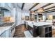 Open kitchen featuring a large marble island with seating and pendant lighting at 4197 Glade Wood Loop, New Port Richey, FL 34655