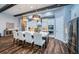 Kitchen island and counter seating, with elegant pendant lighting and stainless steel appliances at 4197 Glade Wood Loop, New Port Richey, FL 34655