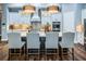 Spacious kitchen island with barstool seating, modern pendant lighting, and stylish cabinetry at 4197 Glade Wood Loop, New Port Richey, FL 34655