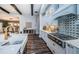 Bright open concept kitchen with stainless steel appliances, modern backsplash and island with seating at 4197 Glade Wood Loop, New Port Richey, FL 34655