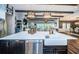 Kitchen island featuring marble countertops, stainless steel appliances, and modern faucet at 4197 Glade Wood Loop, New Port Richey, FL 34655