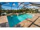 Beautiful pool and spa area with screen enclosure offers a perfect blend of luxury and privacy for relaxation and entertainment at 4197 Glade Wood Loop, New Port Richey, FL 34655
