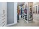 Spacious walk-in closet with custom shelves, cabinets, and ample storage for clothing and accessories at 4197 Glade Wood Loop, New Port Richey, FL 34655