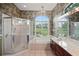 Bathroom featuring a bathtub, shower, and dual sink vanity at 4351 Mallard Lake Dr, Spring Hill, FL 34609