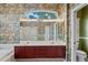 Bathroom featuring dual sinks and large mirrors at 4351 Mallard Lake Dr, Spring Hill, FL 34609