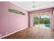 Bedroom with a view of the pool area and sliding glass doors at 4351 Mallard Lake Dr, Spring Hill, FL 34609