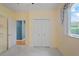 Bedroom features a ceiling fan, carpeted floors, closet, and a window at 4351 Mallard Lake Dr, Spring Hill, FL 34609