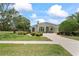 Charming home with a well-manicured lawn and lush landscaping at 4351 Mallard Lake Dr, Spring Hill, FL 34609