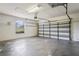 Spacious two-car garage with ample room for parking and storage; includes garage door opener at 4351 Mallard Lake Dr, Spring Hill, FL 34609