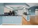 Spacious kitchen with light blue walls, granite countertops, and stylish cabinetry at 4351 Mallard Lake Dr, Spring Hill, FL 34609
