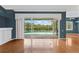 Spacious living room with hardwood floors and a view of the outdoor pool at 4351 Mallard Lake Dr, Spring Hill, FL 34609