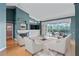 Bright living room with hardwood floors, fireplace, and a view of the pool at 4351 Mallard Lake Dr, Spring Hill, FL 34609