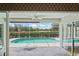 Screened-in pool with golf course view, perfect for outdoor enjoyment at 4351 Mallard Lake Dr, Spring Hill, FL 34609