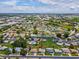 Home aerial view of a quiet residential community with manicured lawns and mature trees at 4567 Great Lakes S Dr, Clearwater, FL 33762