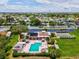 Aerial view of the community featuring a pool, shuffleboard court, clubhouse and parking at 4567 Great Lakes S Dr, Clearwater, FL 33762
